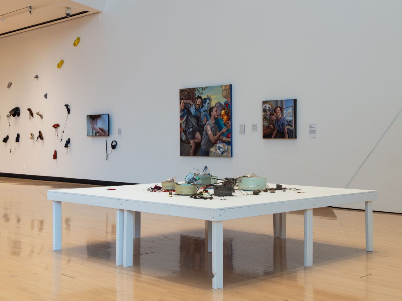 Table with color-coded assorted litter in art gallery